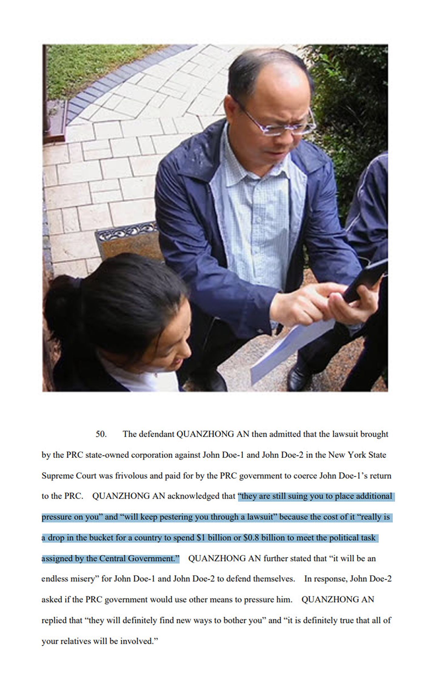 An Quanzhong outside the victim’s home—part of an effort to pressure the victim to return to China by warning that the civil lawsuit against him and his family in the U.S. would not stop. (From DOJ indictment)