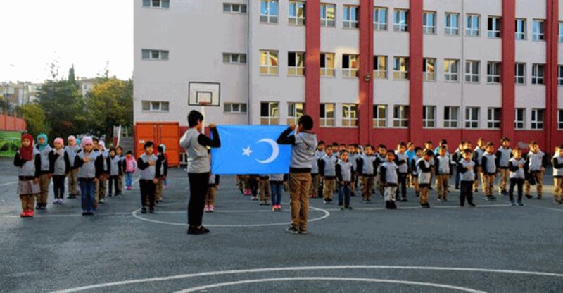 Uyghur students pledge allegiance to the flag of East Turkestan, Uyghurs' preferred name for northwestern China's Xinjiang region, at Hira Uyghur Elementary School in Turkey's capital Istanbul, Aug. 3, 2020. Credit: Hira Uyghur Elementary School