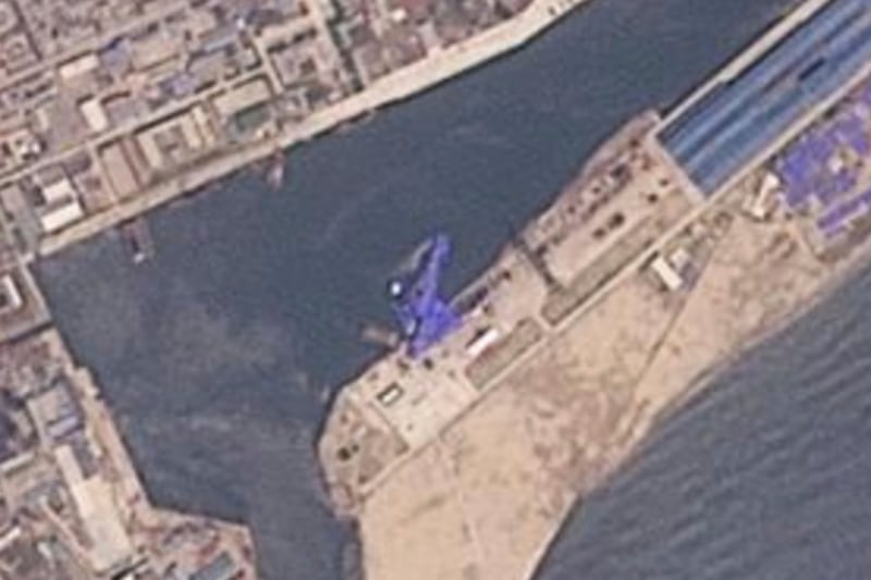This satellite image from Planet Labs PBC shows a blue tarp covering a North Korean destroyer after it suffered a failed launch while it was being put to sea in Chongjin, North Korea, May 22, 2025.