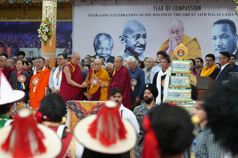 Tibetan spiritual leader the Dalai Lama arrives at the stage during celebrations on the 90th birthday of the Dalai Lama at the Main Temple in Dharamsala, India, July 6, 2025.