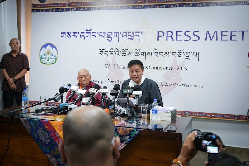 Samdhong Rinpoche, former Prime Minister and Alternate Chairman of the Gaden Phodrang Trust, left, and Penpa Tsering, president of the Tibetan government in exile speak to reporters in Dharamsala, India, July 2, 2025.