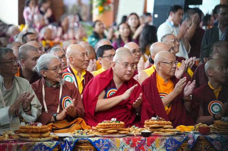 A child is lifted higher to see the stage during celebrations on the 90th birthday of the Dalai Lama at the Main Temple in Dharamsala, India, July 6, 2025.