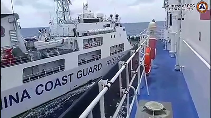 A Chinese coast Guard ship, left, collides with the Philippine Coast Guard ship BRP Teresa Magbanua near the Sabina Shoal in the South China Sea, Aug. 31, 2024.