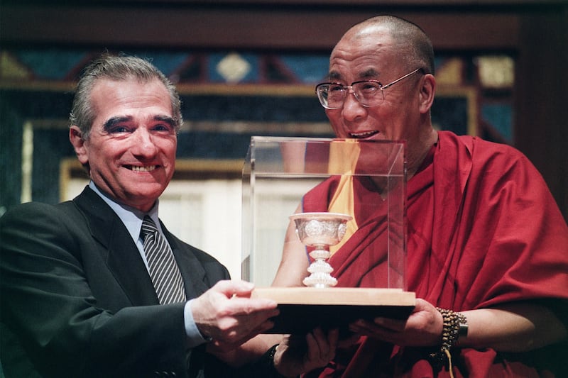 Filmmaker Martin Scorsese and the Dalai Lama pose with the "Light of Truth" award before ceremonies for the International Campaign for Tibet's annual Light of Truth award in New York, April 30, 1998. Scorsese received the award from the Dalai Lama for his film "Kundun."